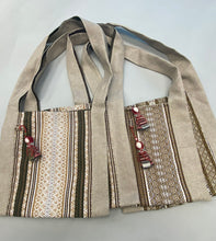 Load image into Gallery viewer, Canvas cross body beige tote with hanging motanka amulet from Bakhmut Creative Workshop