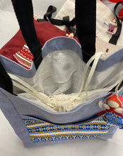 Load image into Gallery viewer, Canvas tote with hanging motanka amulet from Bakhmut Creative Workshop
