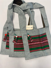 Load image into Gallery viewer, Canvas cross body holiday green tote with hanging motanka amulet from Bakhmut Creative Workshop
