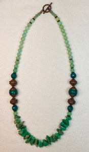 Yara Litosch single strand 24" graduated & round mint chrysoprase beads, 4 copper & 2 copper capped Tibetan focus beads.