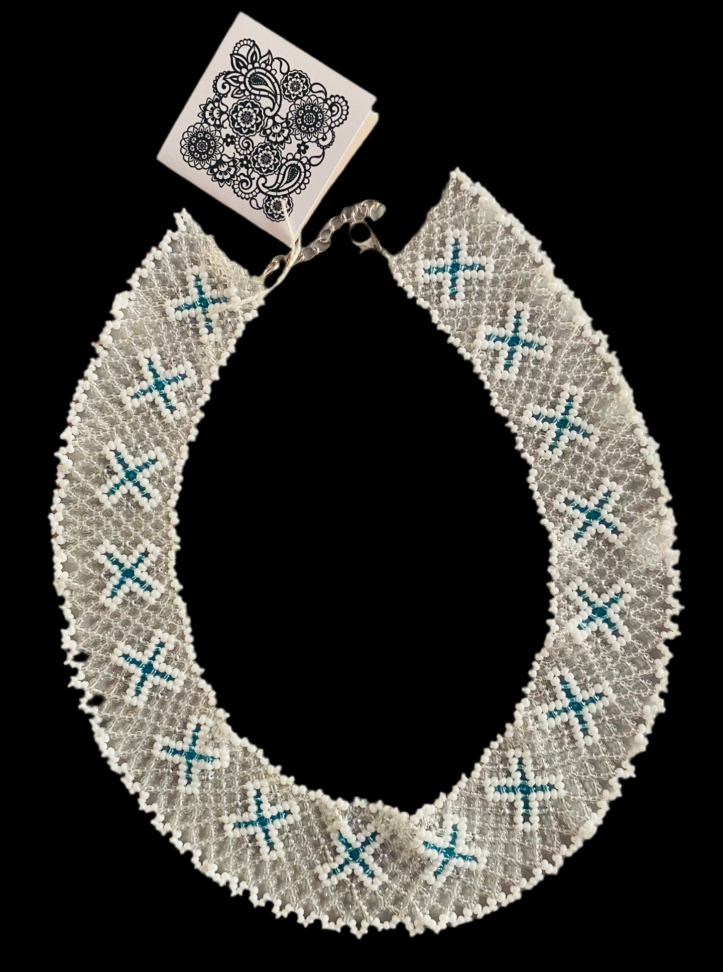 Bakhmut 1 1/2” wide Gerdan collar of clear and white beads with turquoise X’s