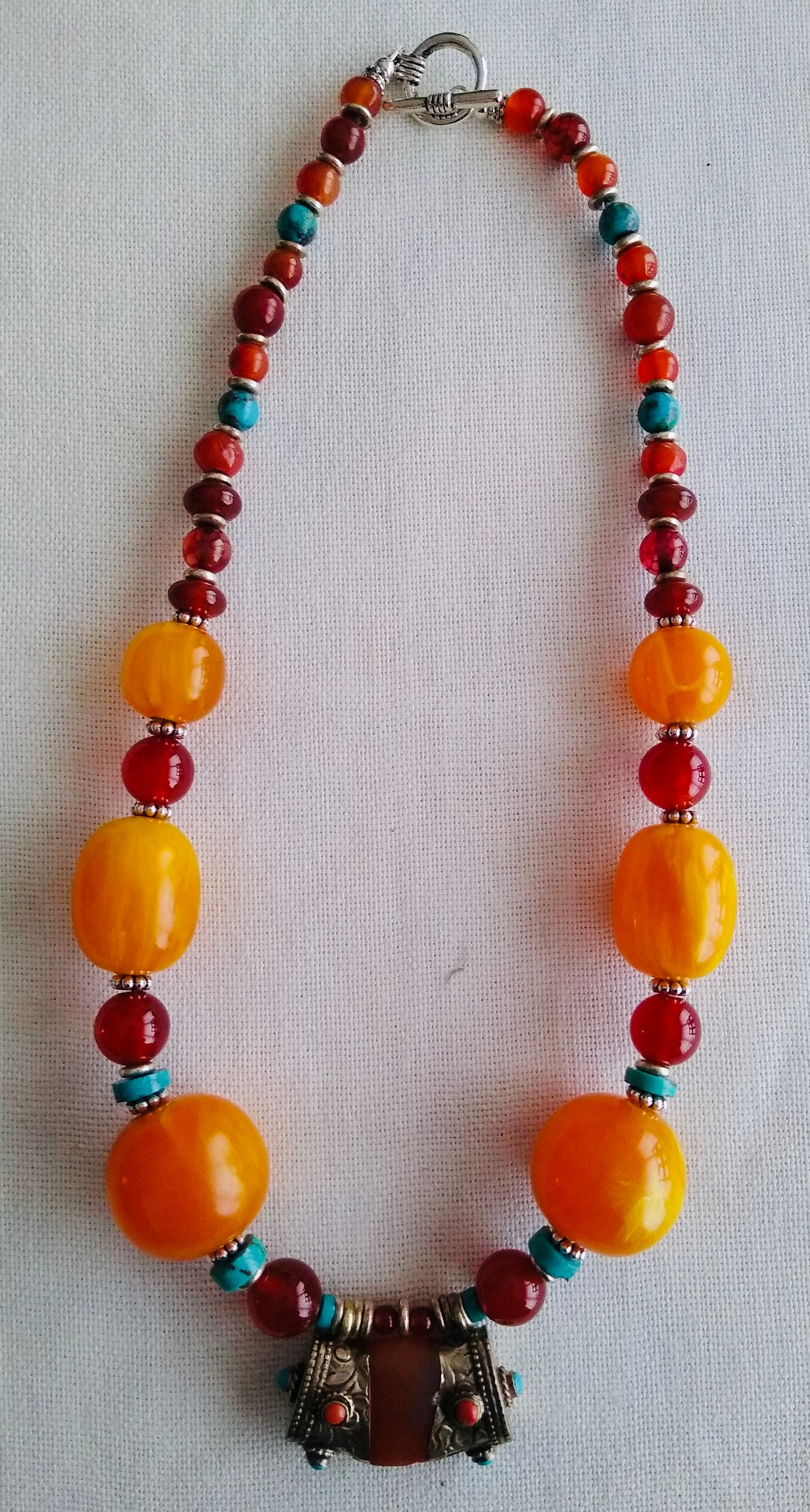 Tania Snihur single strand necklace of Tibetan silver capped amber ,coral & turquoise beads  # 10