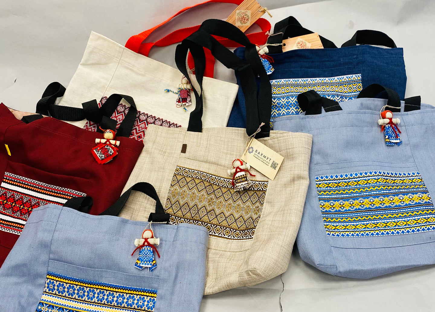 Canvas tote with hanging motanka amulet from Bakhmut Creative Workshop