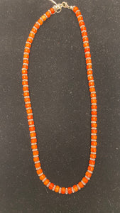 Nina Lapchyk  20"  orange cut coral with  silver spacers   style # 50